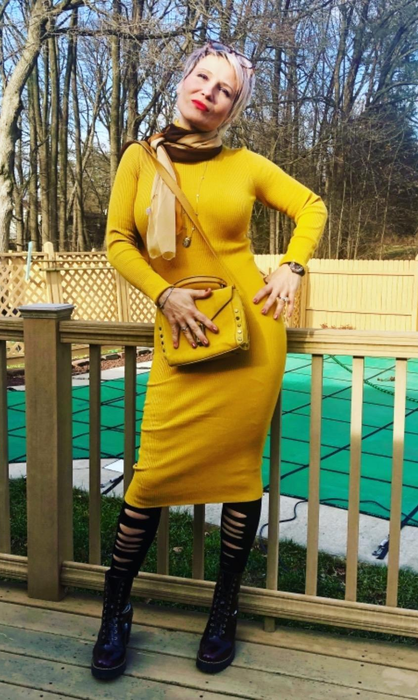 reviewer image wearing the yellow dress on a deck