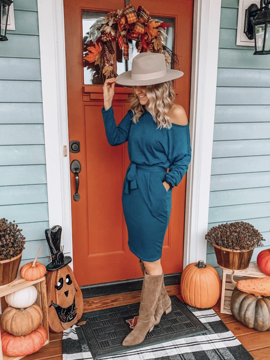 A customer review photo of them wearing the blue dress
