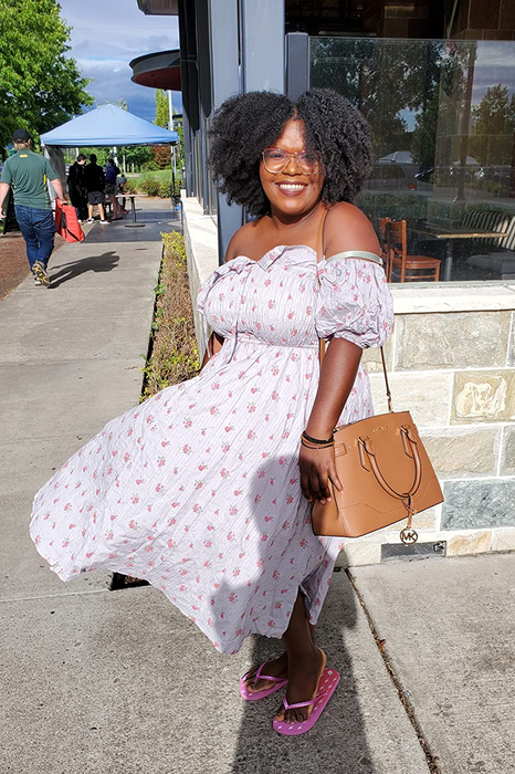 Reviewer in the light blue version, featuring short puff sleeves worn off the shoulder