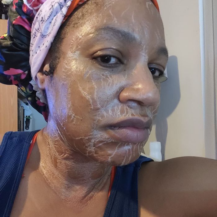 A reviewer showing the effects of the Zombie face mask, highlighting wrinkles and skin texture