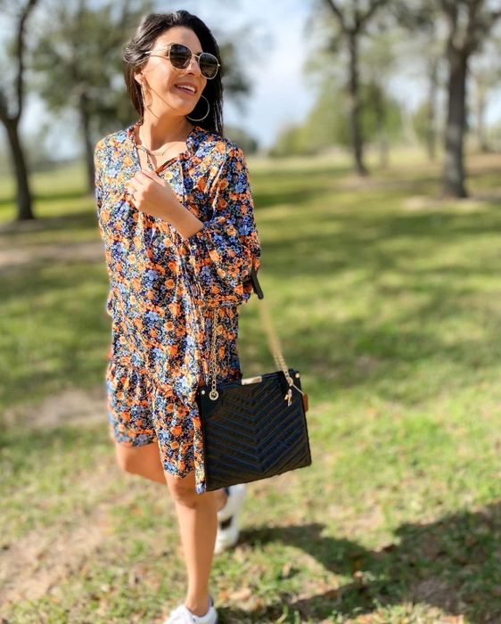 reviewer image wearing the floral minidress outdoors