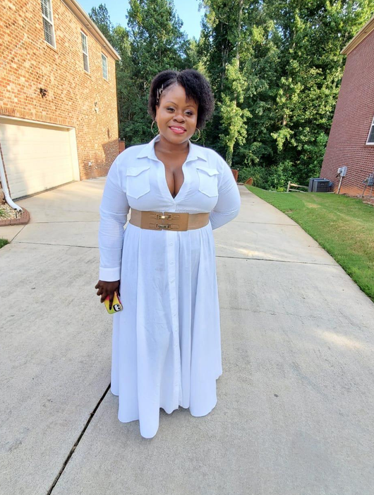 reviewer wearing the white dress