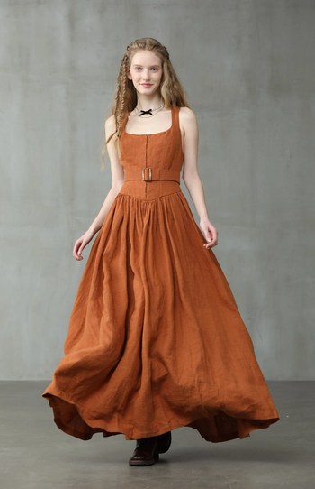 model wearing an orange linen corset dress
