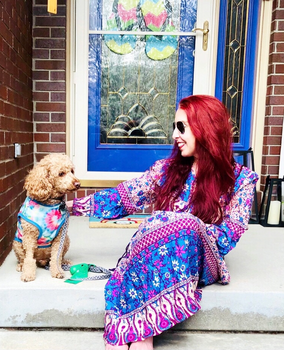 A reviewer in the purple printed version of the dress.