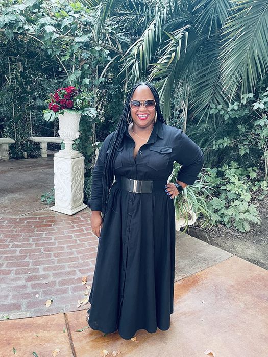 reviewer wearing the black dress
