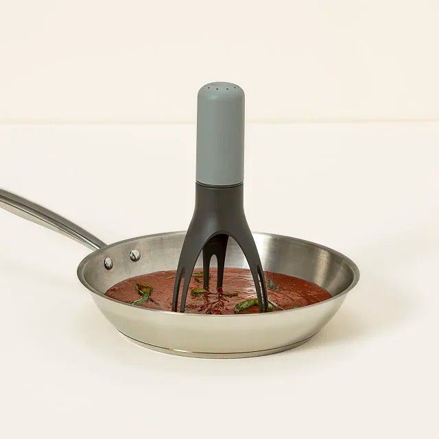 the automatic stirrer actively stirring in a pan