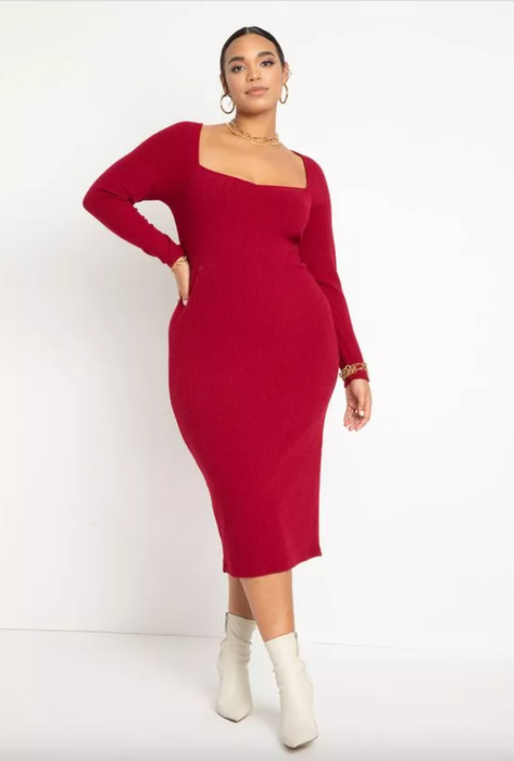 model showcasing a burgundy long-sleeved sweater dress