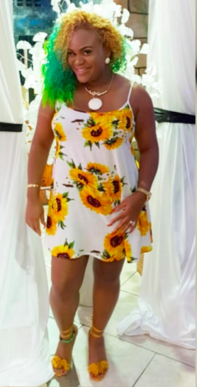 A reviewer showcasing the white dress.
