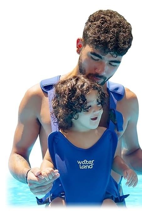 An adult wearing a Water Land carrier with their child safely secured.