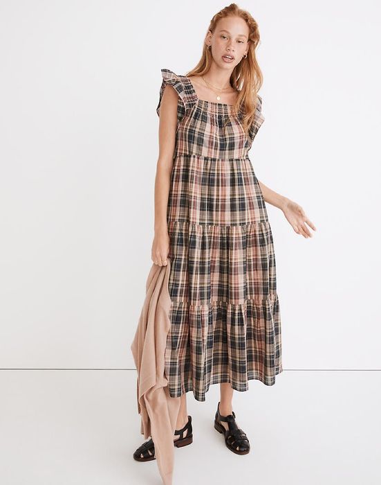 model showcasing a plaid midi dress