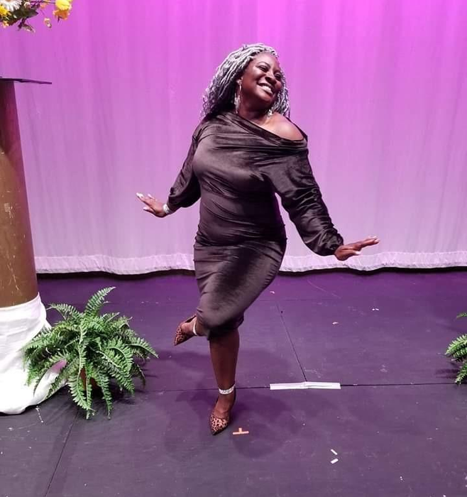 reviewer dancing in the purple dress