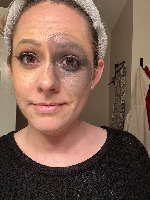 A reviewer beginning to remove their full face of makeup using the cleansing balm