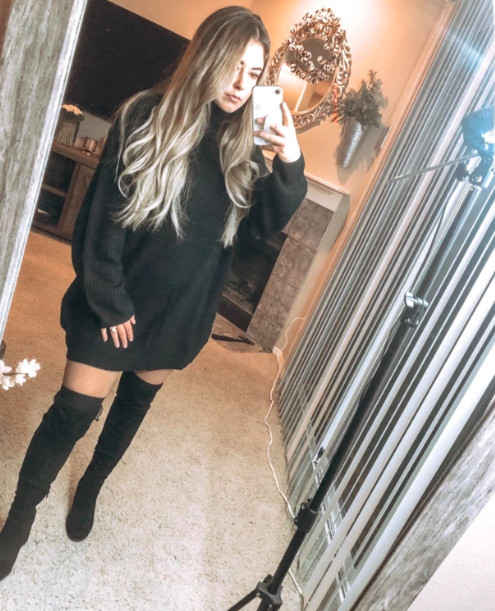 A customer review image of them in the black dress