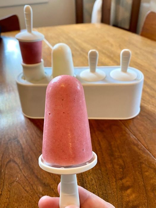 An ice pop placed in front of the silicone mold, ready to be enjoyed.