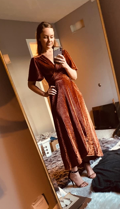 reviewer mirror selfie in the orange velvet dress