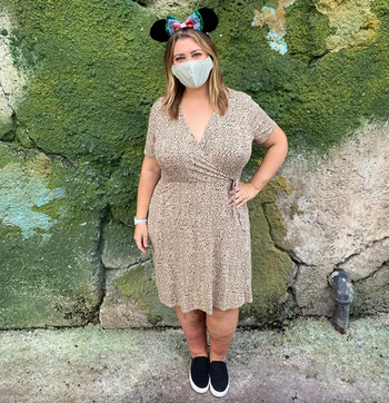 reviewer showcasing the dress in leopard print