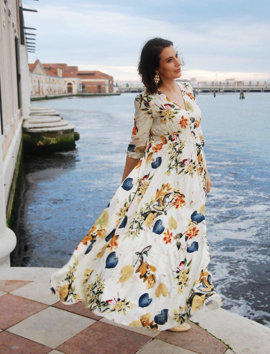 reviewer modeling the dress in white