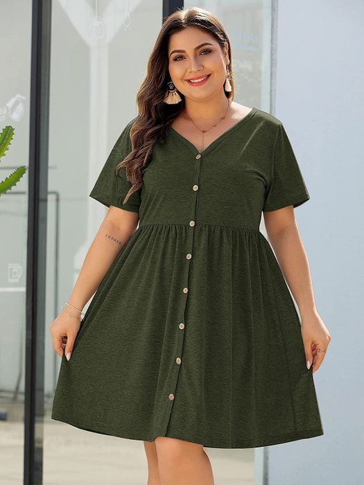 model showcasing a green dress with button accents