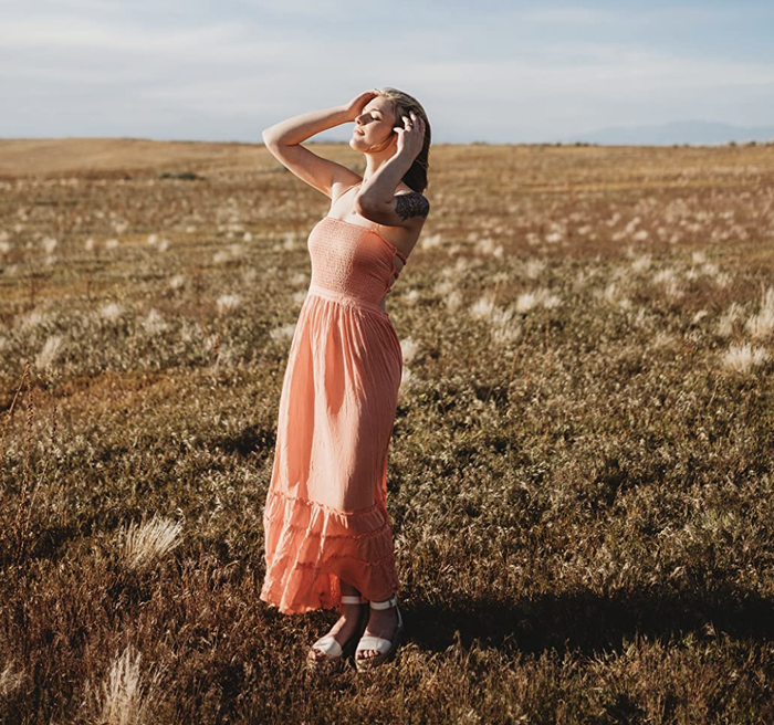 reviewer showcasing the front view of the dress