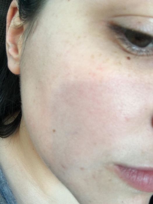 The expression on the reviewer's face after using the moisturizer