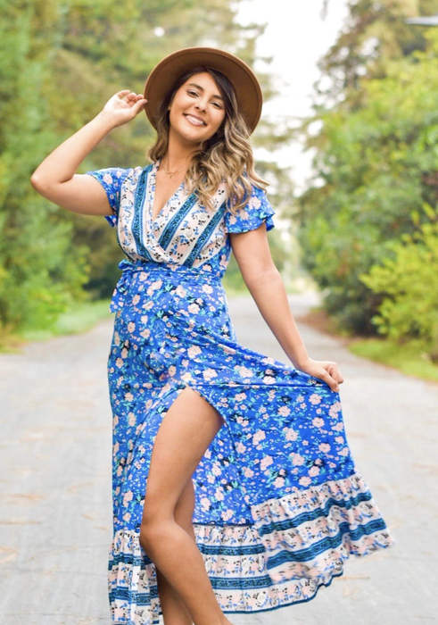 reviewer wearing the dress in blue