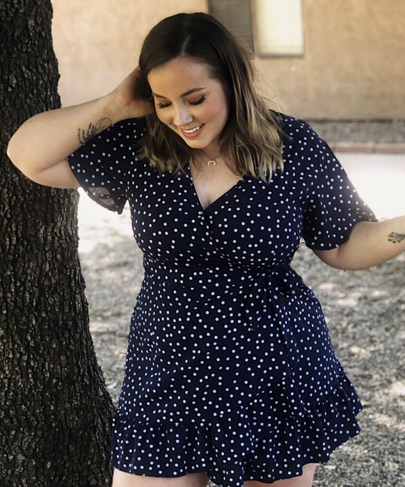A customer review photo of the V-neck dress in blue