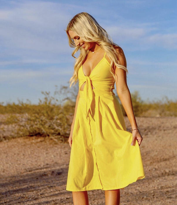 reviewer modeling the dress in yellow