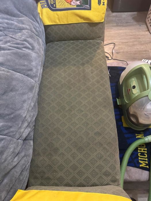 The same couch, now spotless, after using the Little Green cleaner, which can be seen next to the couch on the right