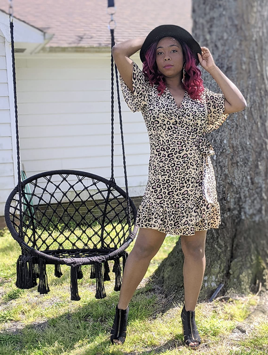 reviewer modeling the dress in leopard print