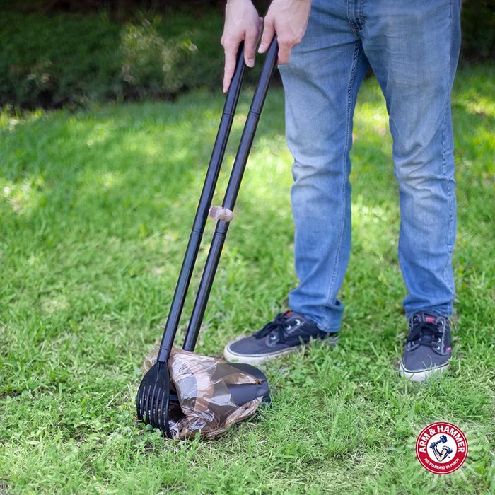 a model demonstrating the use of the pooper scooper
