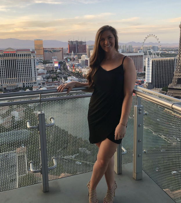 reviewer modeling the dress in black