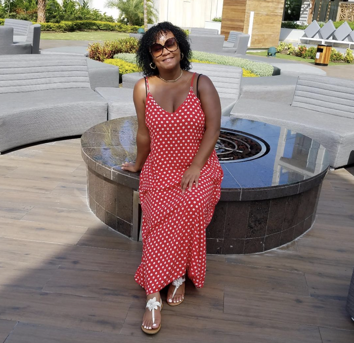 A customer review photo of the maxi dress in red polka dots