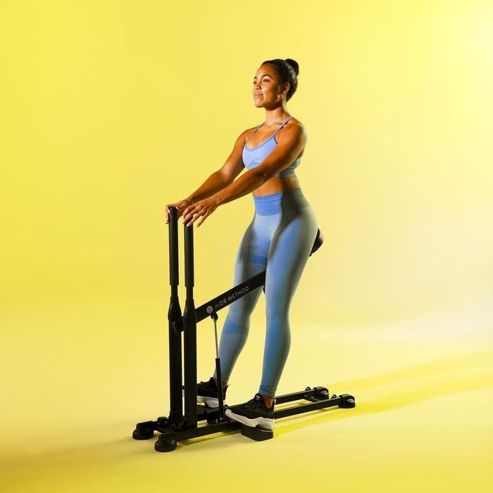a model demonstrating the use of the squat machine