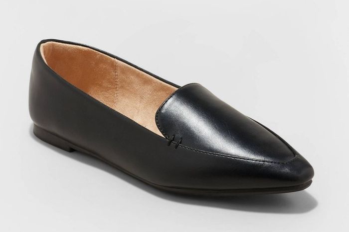 A single black leather loafer with a pointed toe and a subtle heel, displayed on a neutral background.