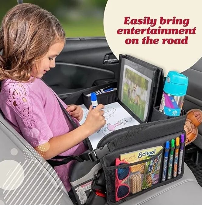 A child in a car seat using a backseat organizer equipped with a tablet holder and drawing tools