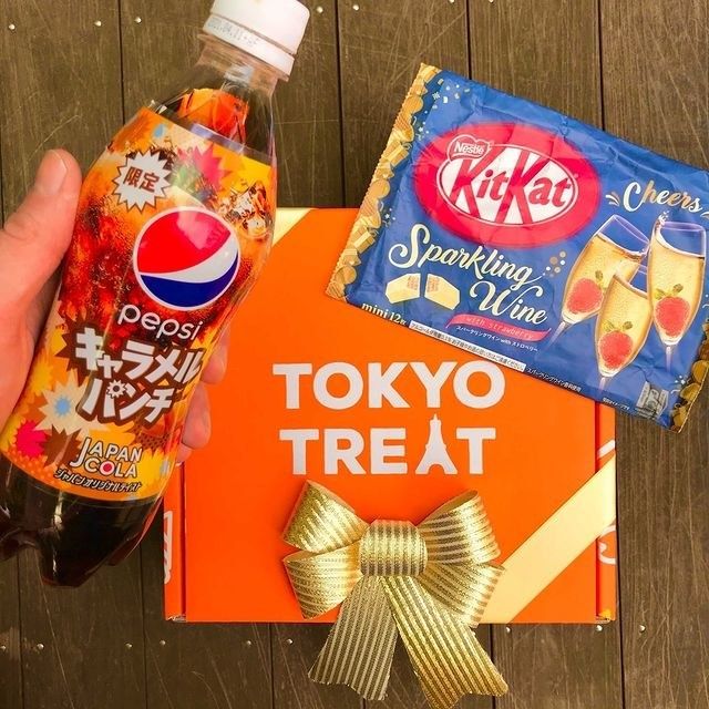 a bottle of Pepsi from Japan and sparkling wine Kit Kats