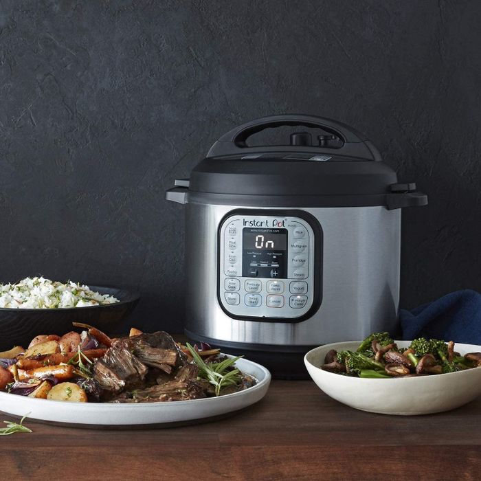 an Instant Pot with a dish of food placed in front of it