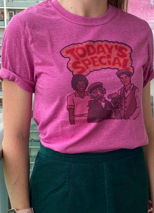 Individual wearing a T-shirt with a "Today's Special" graphic showcasing cartoon characters