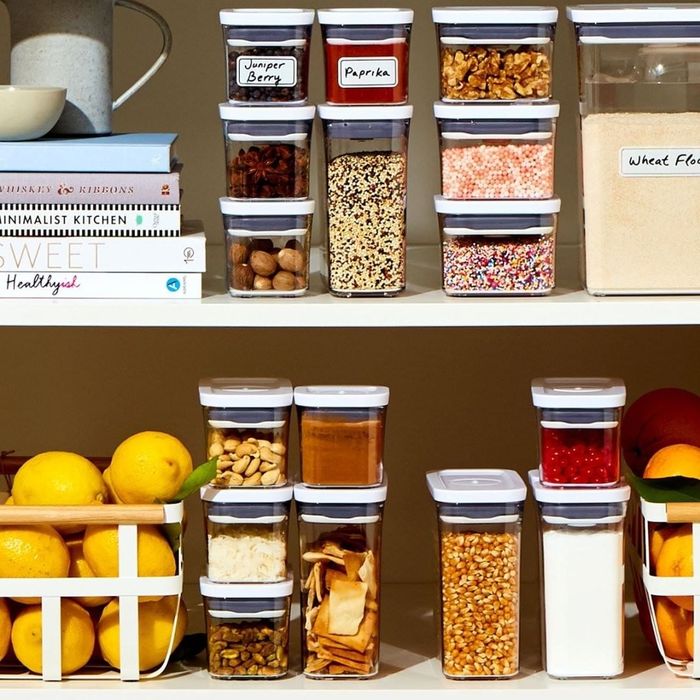 a collection of Pop containers neatly arranged in a pantry