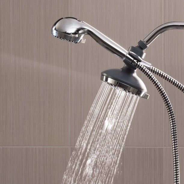 A showerhead with adjustable spray settings, demonstrating water flow. Featured in a shopping article promoting bathroom upgrades