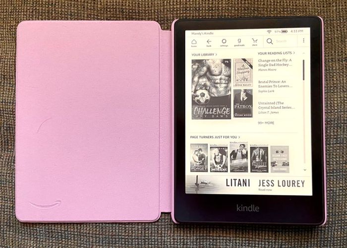 The Kindle inside a pink folding case