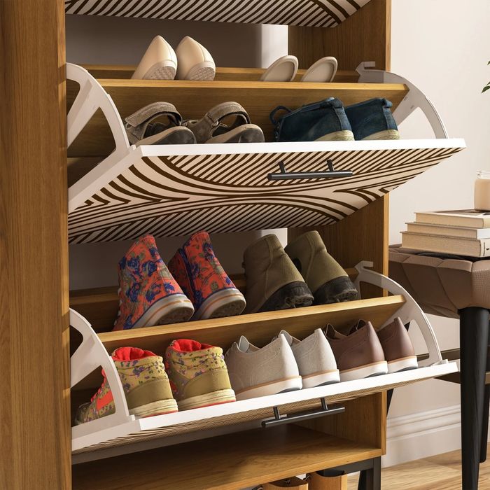 A shoe rack with multiple compartments neatly holding casual and athletic shoes, displayed in a tidy home environment