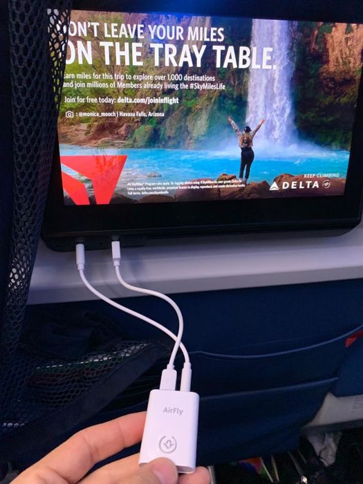The white plug-in Bluetooth converter.