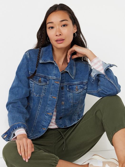 Model showcasing the medium wash jacket