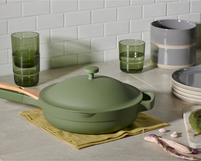 A green pan resting on a kitchen counter.