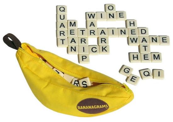 The letter tiles arranged into connected words, alongside the banana-shaped pouch.
