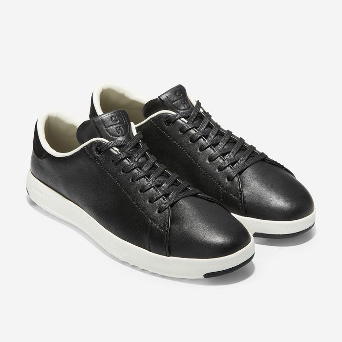 black leather sneakers featuring white rubber soles