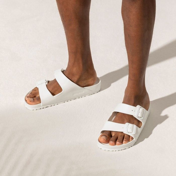 model wearing the white sandals