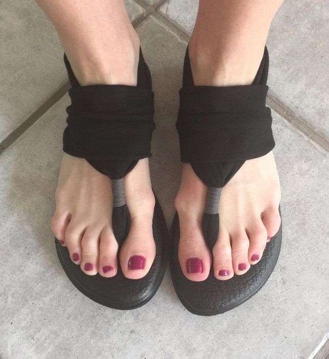 photo of black flat sandals with an ankle sling strap, taken by a reviewer