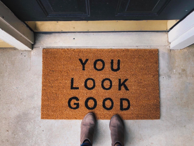 The brown doormat featuring the text "YOU LOOK GOOD" in bold black letters.